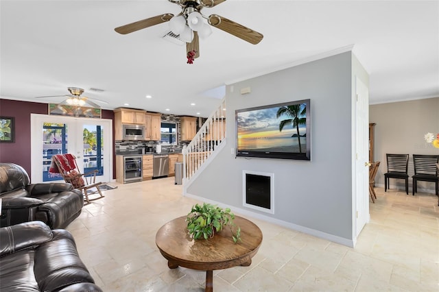 living room featuring ornamental molding, wine cooler, and french doors