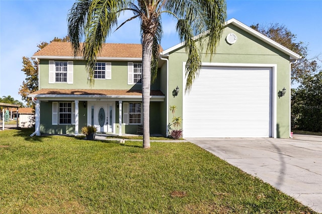 view of front of property with a garage and a front yard