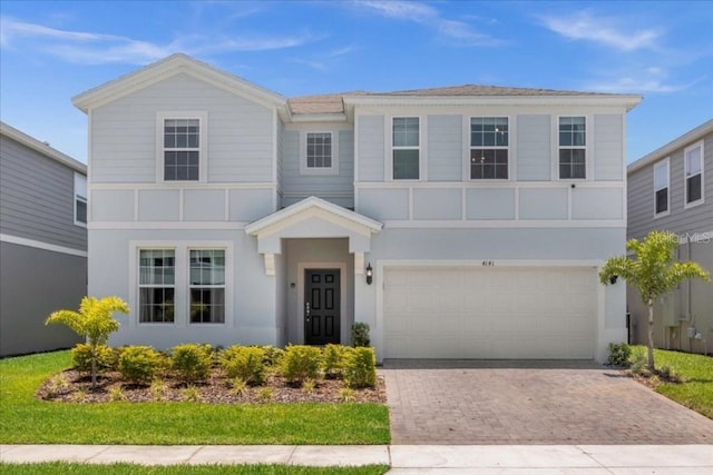 4141 Lana Ave, Davenport, FL 33897 - view of front of property with a garage