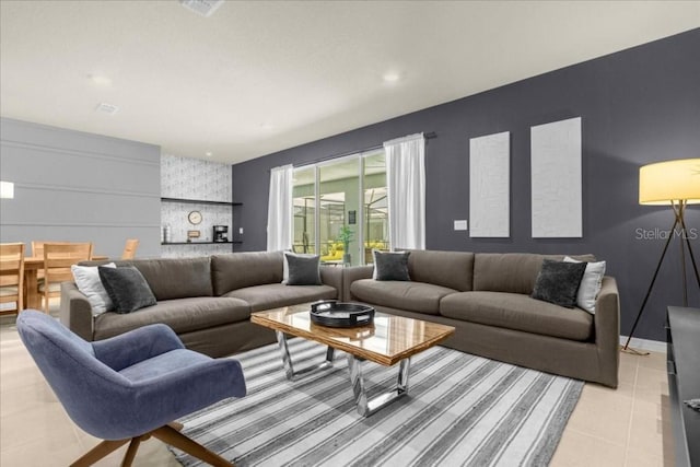4141 Lana Ave, Davenport, FL 33897 - living room featuring light tile patterned floors and an accent wall
