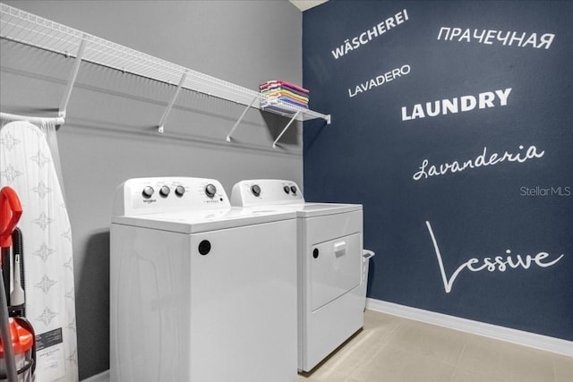 4141 Lana Ave, Davenport, FL 33897 - washroom with washer and dryer and baseboards