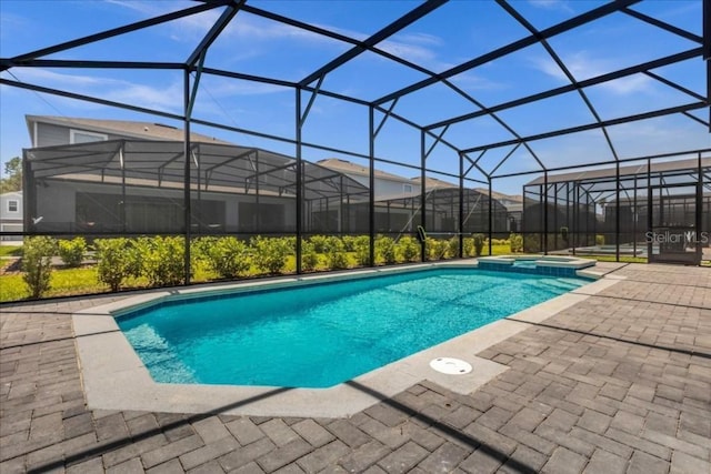 4141 Lana Ave, Davenport, FL 33897 - view of swimming pool featuring a patio, a pool with connected hot tub, and a lanai