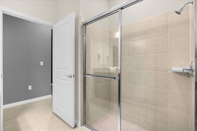 bathroom with a shower with shower door