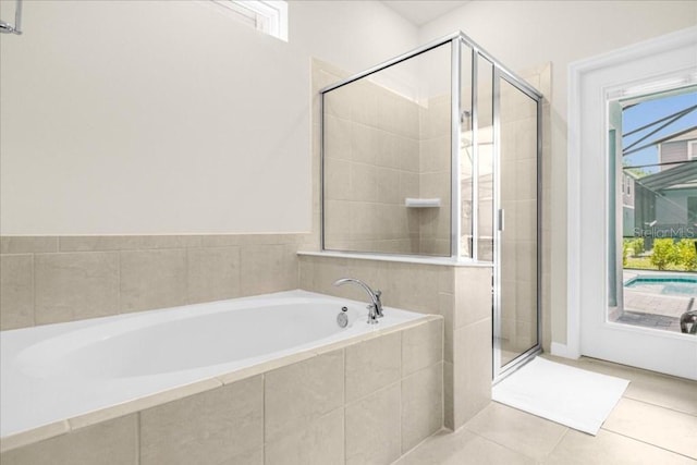 bathroom featuring plus walk in shower and tile patterned floors