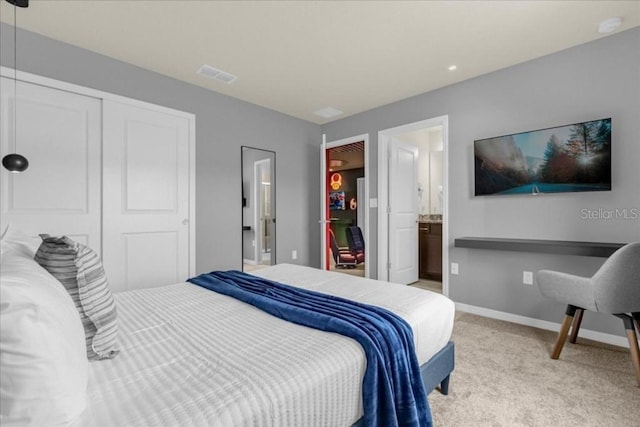 4141 Lana Ave, Davenport, FL 33897 - bedroom with light carpet, a closet, and ensuite bath