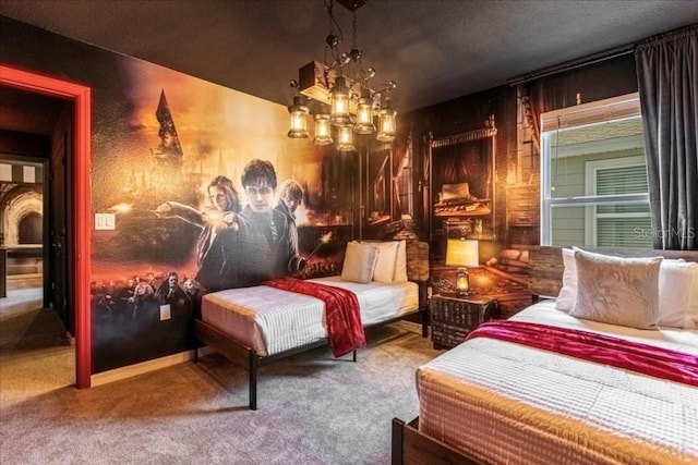 bedroom with carpet and a notable chandelier