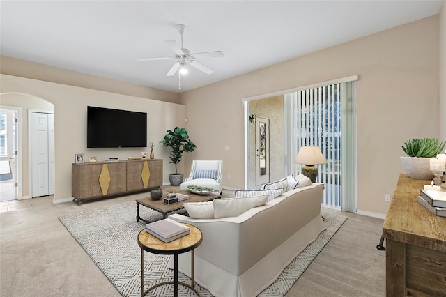 living room featuring ceiling fan and light carpet