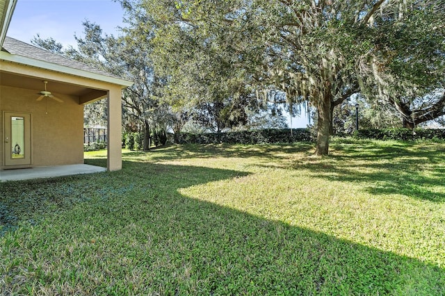 view of yard featuring ceiling fan