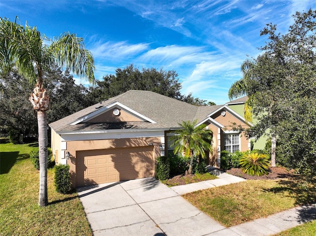 view of front of home featuring a garage and a front lawn