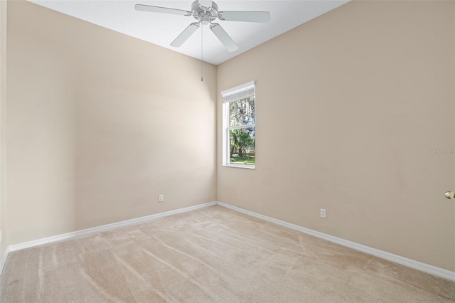 unfurnished room featuring ceiling fan and light colored carpet