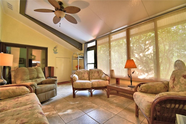 sunroom with lofted ceiling, ceiling fan, and a healthy amount of sunlight