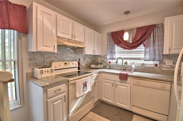 kitchen featuring white appliances and white cabinets