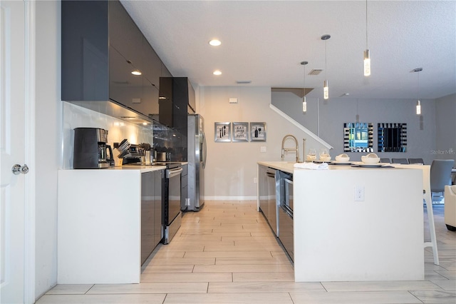 kitchen with a breakfast bar, light hardwood / wood-style flooring, tasteful backsplash, decorative light fixtures, and stainless steel appliances