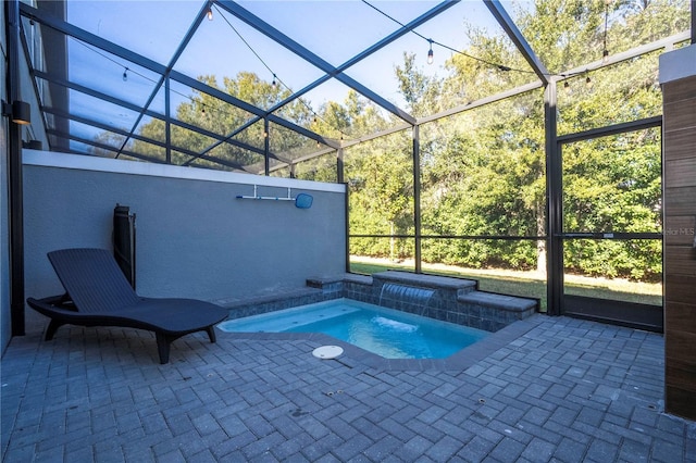 view of pool with a lanai and a patio