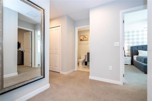 corridor with light carpet