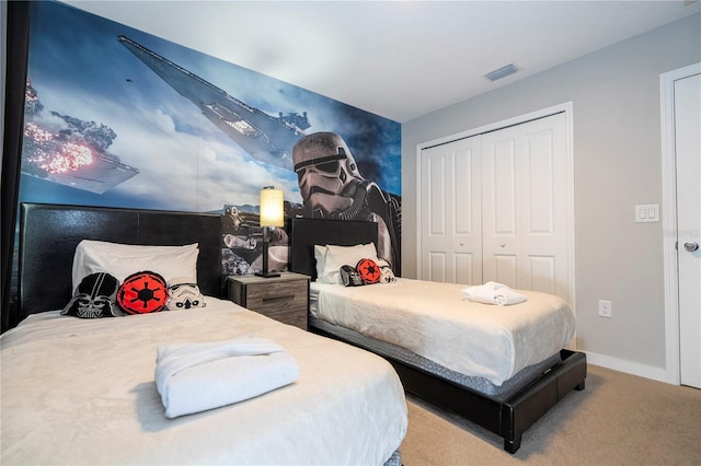 carpeted bedroom featuring a closet