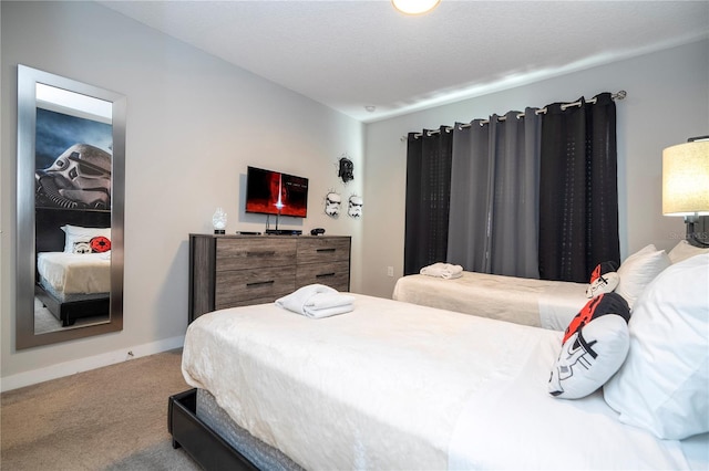 bedroom featuring carpet and a textured ceiling