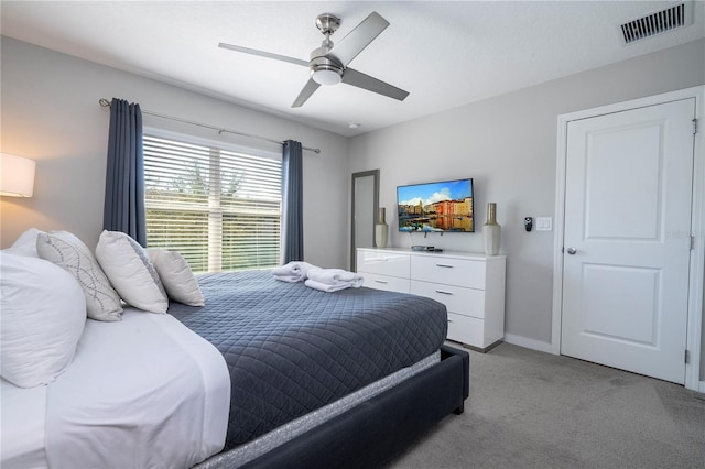 carpeted bedroom with ceiling fan