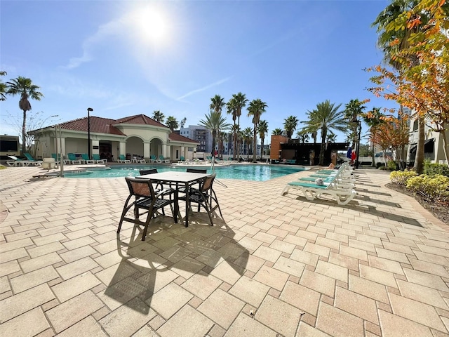 view of swimming pool with a patio area