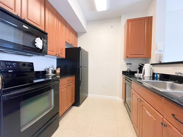 kitchen with black appliances, light tile patterned floors, and sink