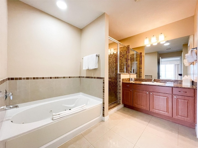 bathroom with tile patterned floors, vanity, and independent shower and bath