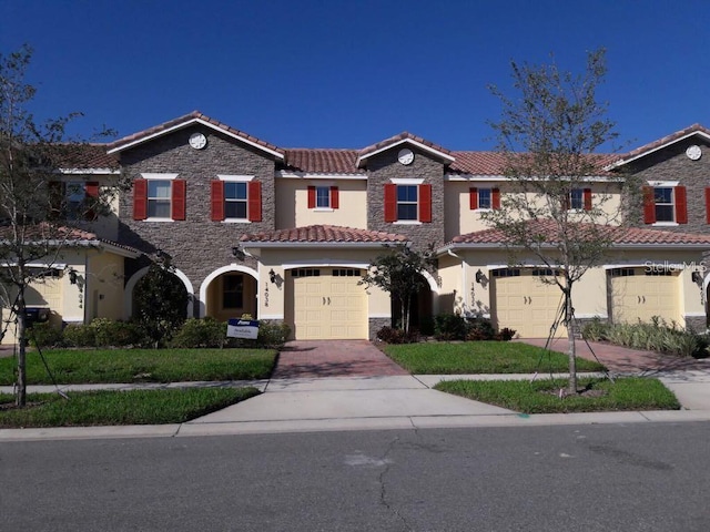 mediterranean / spanish-style house featuring a garage