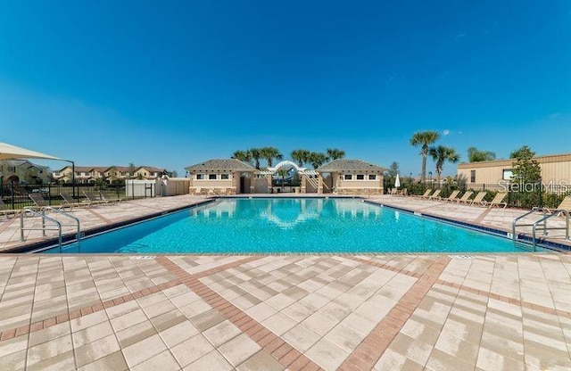 view of swimming pool with a patio area