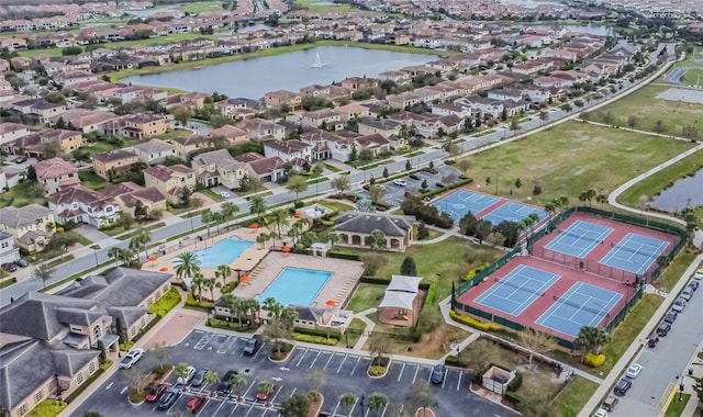 bird's eye view with a water view and a residential view