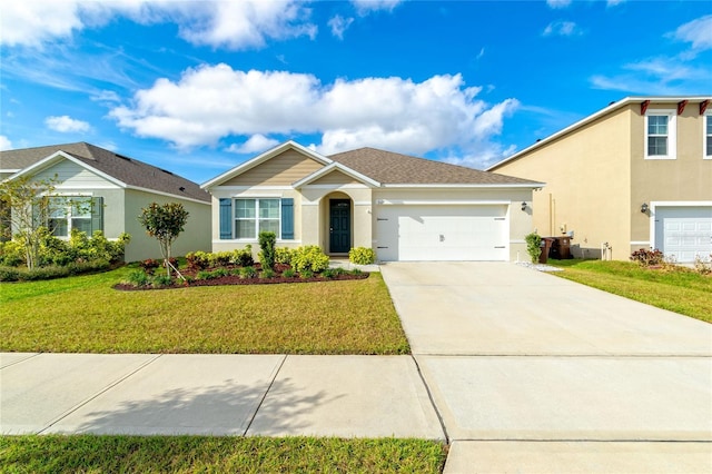 view of front facade with a front yard and a garage