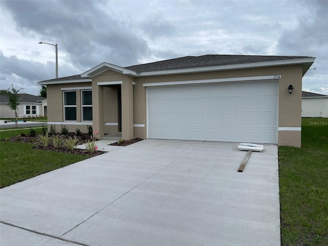 ranch-style home with a garage and a front yard