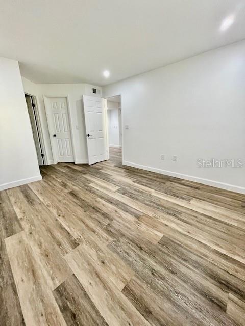 spare room featuring hardwood / wood-style floors