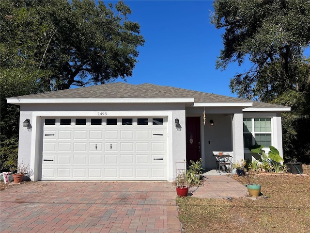 ranch-style house featuring a garage