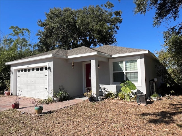 ranch-style house featuring a garage