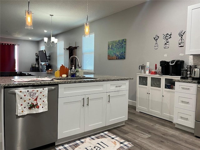 kitchen with stainless steel dishwasher, sink, decorative light fixtures, white cabinets, and dark hardwood / wood-style floors