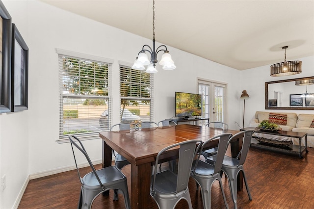 dining space with a chandelier and dark wood-type flooring