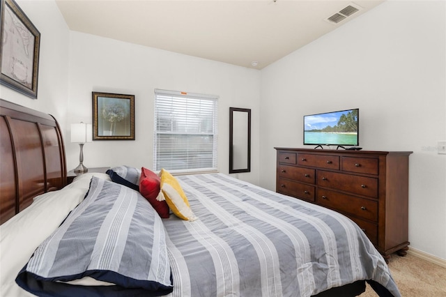 bedroom with light colored carpet