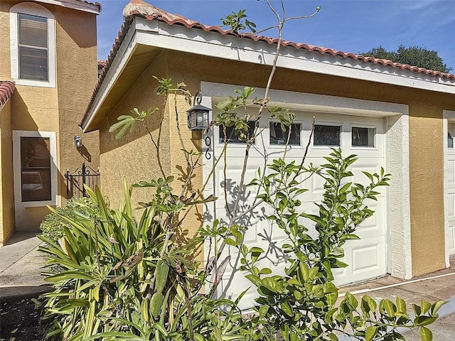 view of property exterior with a garage