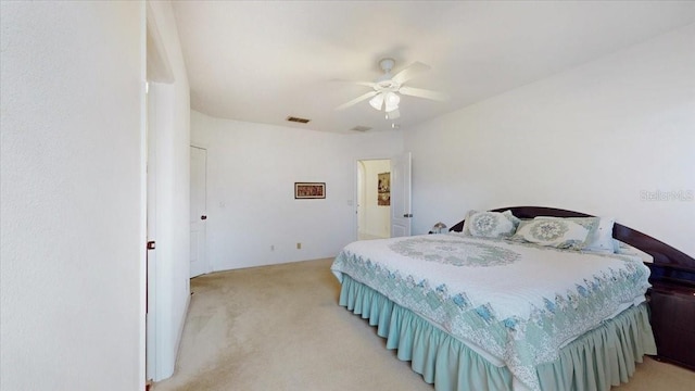 bedroom with light carpet and ceiling fan