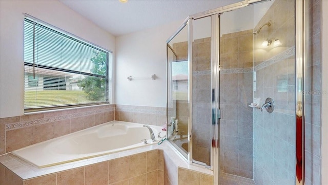 bathroom with separate shower and tub