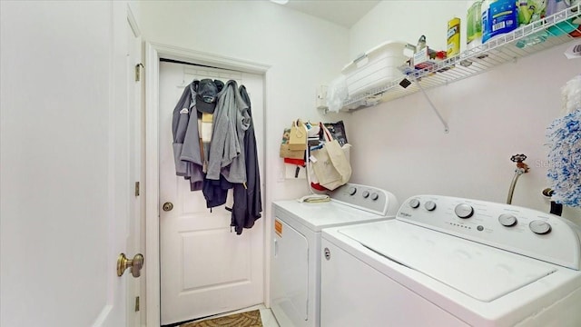 laundry room with independent washer and dryer