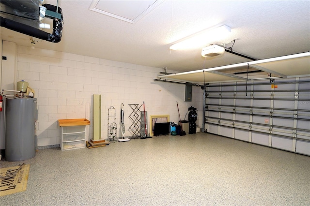 garage featuring water heater, a garage door opener, and electric panel