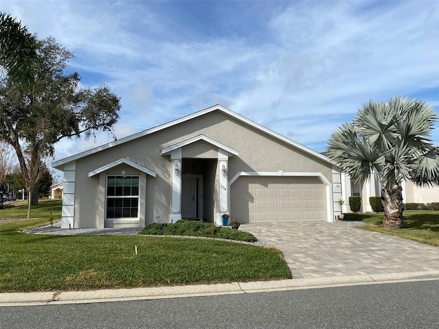 ranch-style house with a garage and a front yard