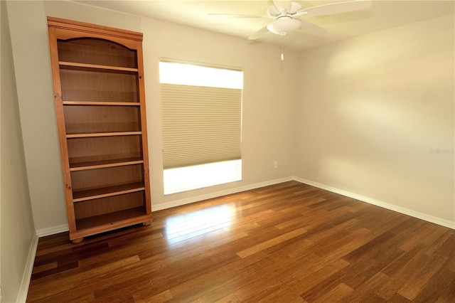 unfurnished bedroom featuring dark hardwood / wood-style flooring and ceiling fan