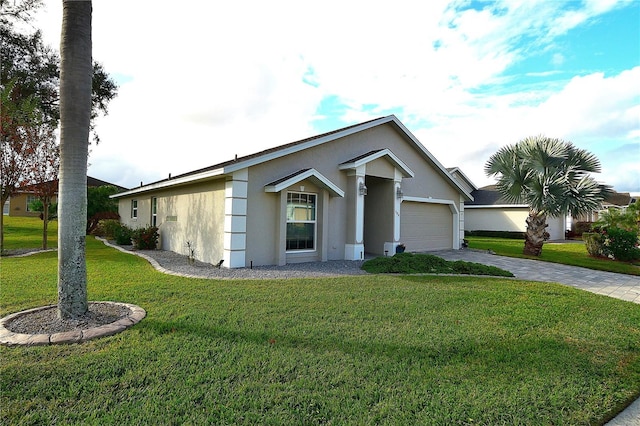 ranch-style home with a garage and a front lawn