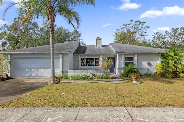 ranch-style home with a front lawn and a garage