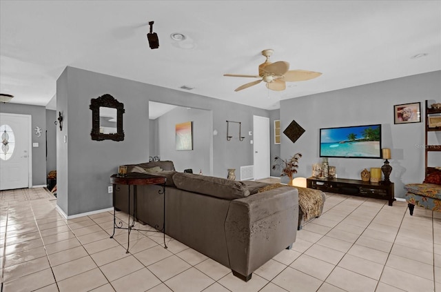 living room with ceiling fan and light tile patterned floors