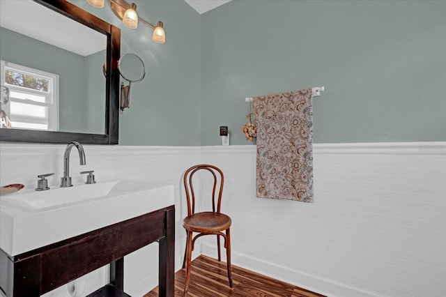 bathroom with vanity and hardwood / wood-style flooring