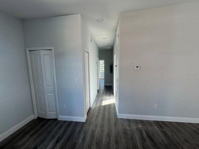 spare room with dark hardwood / wood-style flooring