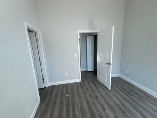 spare room featuring dark hardwood / wood-style floors