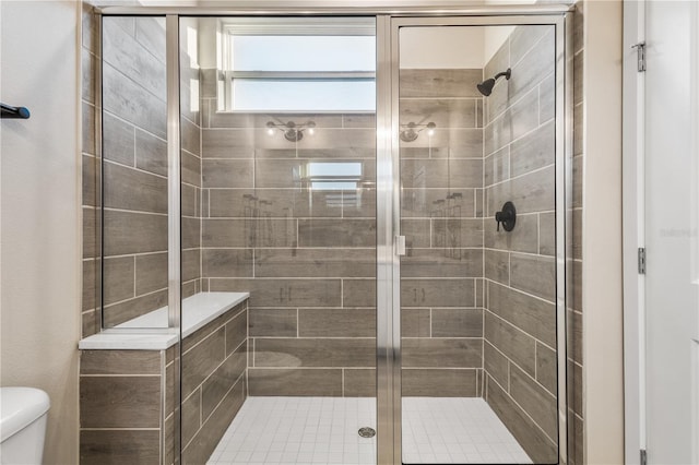 bathroom with toilet and walk in shower